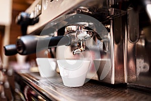 Espresso machine making coffee in pub or restaurant