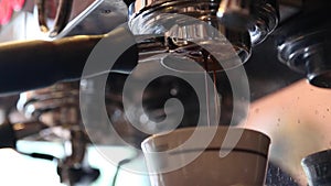 Espresso machine pouring coffee from bottomless