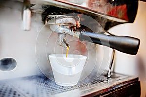 espresso machine pouring coffee in cups, cappuccino and coffee