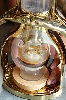Espresso machine press coffee on vanilla ice cream