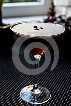 Espresso Martini Cocktail with coffee beans.