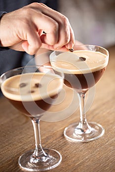 Espresso martini vodka short drink as a coffee cocktail inclduing coffee liqueur and vanilla syrup