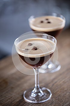 Espresso martini vodka short drink as a coffee cocktail inclduing coffee liqueur and vanilla syrup