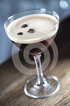 Espresso martini vodka short drink as a coffee cocktail inclduing coffee liqueur and vanilla syrup