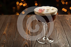 Espresso martinis cocktail garnished with coffee beans.