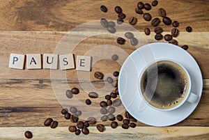 Espresso pause concept background on wood