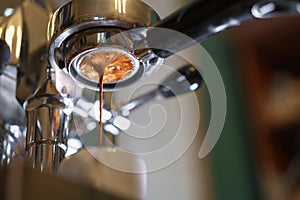 Espresso pouring from bottomless portafilter photo