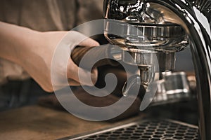 Espresso pouring from coffee machine. coffee machine preparing fresh coffee and pouring into red cups at restaurant, bar or pub