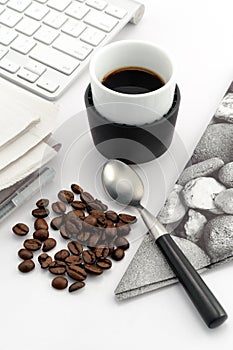 Espresso in small cup with coffee beans