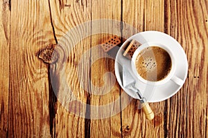 Espresso on the Table with Trowel and Bricks photo