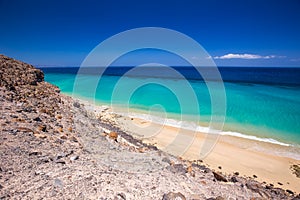 Esquinzo sandy beach with vulcanic mountains, Jandia, Fuerteventura, Canary Islands, Spain photo