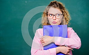 Essay writing. teacher with document folder. girl teacher at private lesson. copy space. student in glasses at