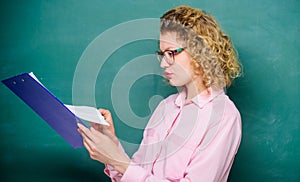 Essay writing. teacher with document folder. student in glasses at blackboard. girl teacher at private lesson. school