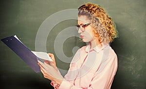 essay writing. teacher with document folder. student in glasses at blackboard. girl teacher at private lesson. school