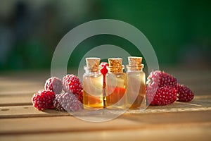 Essence of Wild raspberries  on table in beautiful glass Bottle