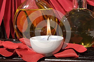 Essential body massage oils with candles photo