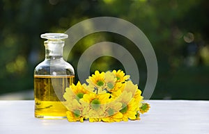 Essential floral oil. Flower elixir and fresh summer flowers. Spa and beauty care.