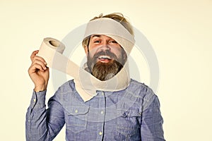 Essential goods. Consumerism. Man hold toilet paper. Hipster with tissue. limit usage. Online shop. Guy having fun with