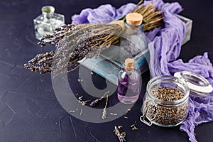 Essential lavender oil and dry lavender flowers.