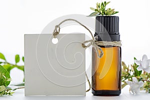 Essential oil, empty tags and flowers