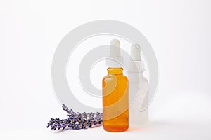 Essential oil in a glass bottle with a pipette.