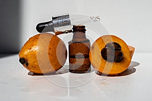 Essential oil of Japanese medlar. Nepole frutta Japanese medlar. photo