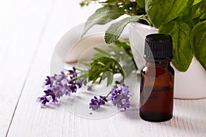 Essential oil and lavender flowers