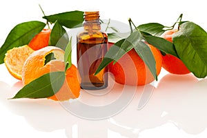 Essential oil of orange mandarin citrus fruit in little bottle d