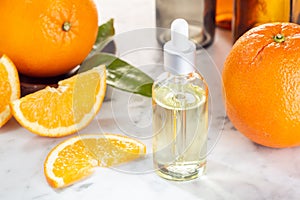 Orange essential oil. Orange oil on glass bottle with dropper. Citrus oil