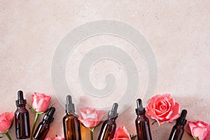 Essential oils in bottles rose flowers. alternative medicine aromatherapy