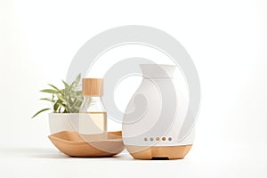 essential oils and ceramic diffuser on white background