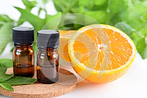 Essential oils with orange and mint photo