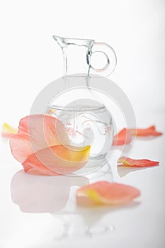 Essential rosewater in glass jug photo