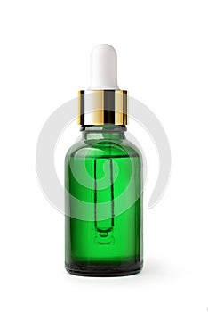 Essential serum oil in green dropper bottle