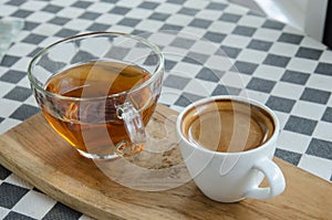 Esspresso coffee in a white cup on the table.