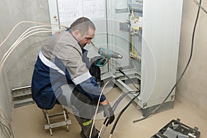 Establishing the connection of cable gland for connection to electrical networks. Electrical engineer at work