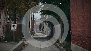 Establishing shot of an alleyway in a ghetto neighborhood.