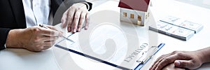 Estate agent broker reach contract form and presentation to client signing agreement contract real estate with approved mortgage