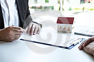 Estate agent broker reach contract form and presentation to client signing agreement contract real estate with approved mortgage