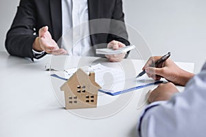 Estate agent broker receive money from client after signing agreement contract real estate with approved mortgage application form