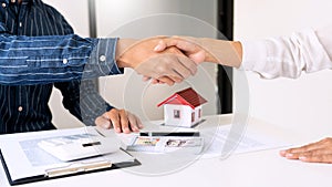 Estate agent giving house keys customer sign agreement property for sale, Buying and selling homes concept.