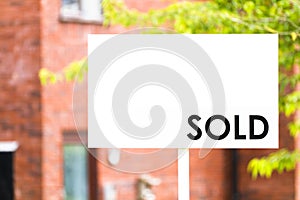 Estate agent house sold sign