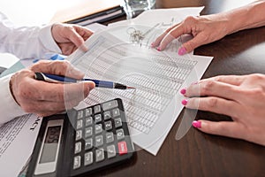 Estate agent showing a financial plan