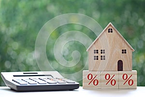 Estate tax,Model house with Percentage symbol icon on green background,Business investment and Property tax concept