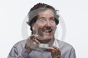 Estatic man holding dollar bill, horizontal