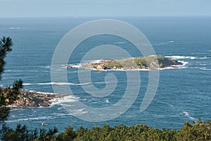 The Estela Islands in NigrÃ¡n in front of the Monteferro peninsula photo