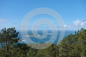 The Estela Islands in NigrÃ¡n in front of the Monteferro peninsula photo