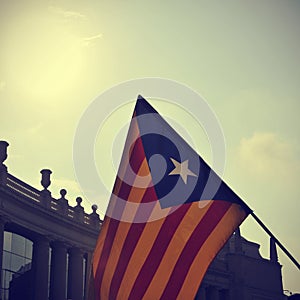 The estelada, the Catalan pro-independence flag, against the sky