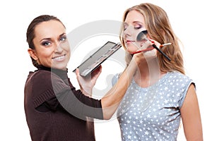 Esthetician applying eyeshadow