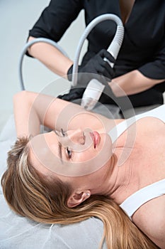 Esthetician doctor performs an effective RF lifting procedure